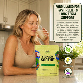 Person holding a glass of Stomach Soothe with product packaging